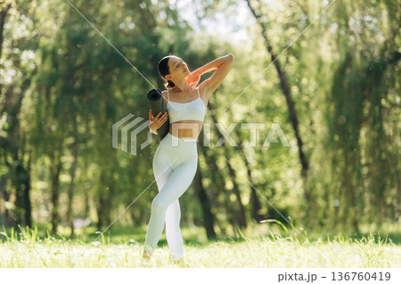 Beautiful fitness yoga woman is outdoors, amazing nature 136760419