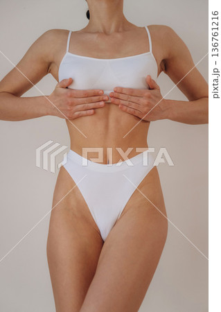 White underwear. Close up view of woman that is in fitness clothes White underwear. Close up view of woman that is in fitness clothes 136761216