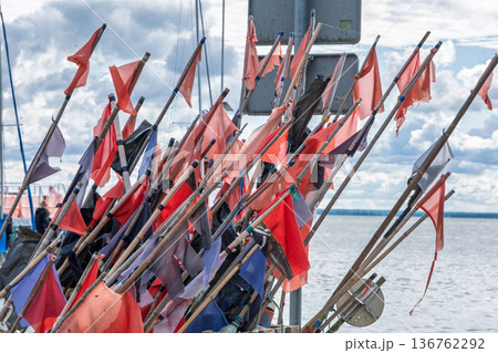 Collection of fishing flags by the sea Collection of fishing flags by the sea 136762292