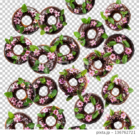 Chocolate glazed donuts topped with pink edible flowers and mint leaves, isolated on a white background Chocolate glazed donuts topped with pink edible flowers and mint leaves, isolated on a white background 136762721