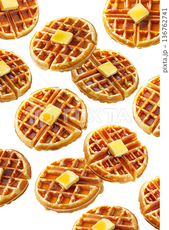 Delicious golden waffles topped with butter and syrup isolated on a white background. Concept of breakfast food 136762741