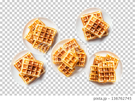 Multiple plates of golden waffles with creamy topping isolated on white background, concept of delicious breakfast food 136762745