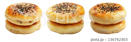 Stack of golden brown fluffy Korean Hotteok pancakes lightly dusted with powdered sugar, isolated on white background 136762803