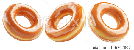 Tasty round donut topped with caramel and vanilla glaze swirl, isolated on white transparent background 136762807