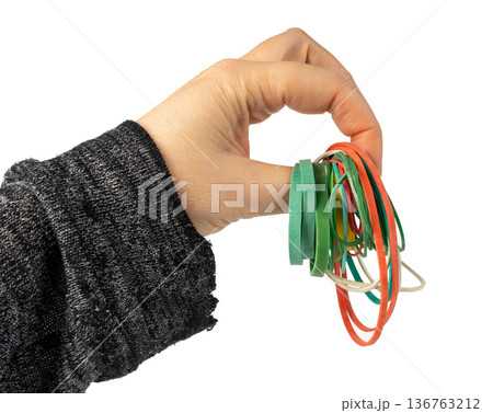 Rubber band isolated. Elastic rubberband bracelets pile, plastic flexibility circles 136763212