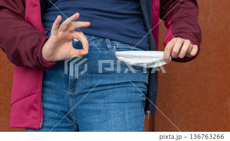 Empty pockets close-up. Woman is showing financial loss, no money, poor person Empty pockets close-up. Woman is showing financial loss, no money, poor person 136763266