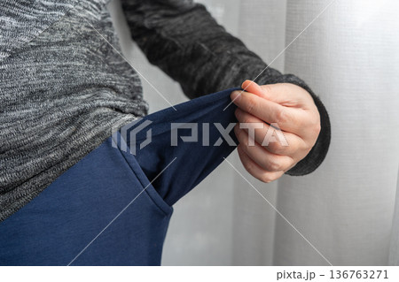 Empty pockets close-up. Person is showing financial loss, no money, poor person 136763271