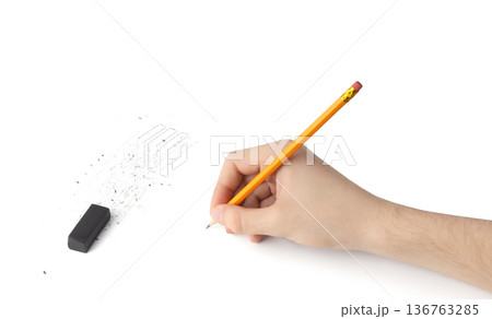 Eraser on paper. Erasing what was written, deleting an error, correcting mistake Eraser on paper. Erasing what was written, deleting an error, correcting mistake 136763285