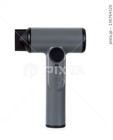 Modern matte grey hair dryer with nozzle isolated on white background. Minimalist portable beauty tool design. Modern matte grey hair dryer with nozzle isolated on white background. Minimalist portable beauty tool design. 136764320