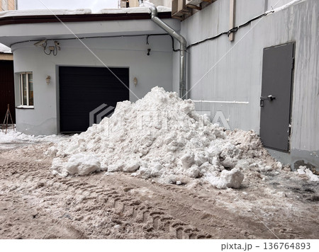Large dirty snow pile accumulating in urban street Large dirty snow pile accumulating in urban street 136764893