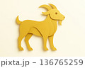Paper goat created from layered golden shapes with clean minimalist lines and smooth paper texture. Modern decorative design on a light background. 136765259