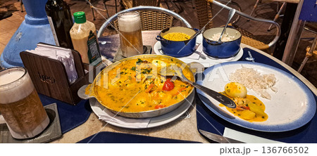 Typical amazonian brazilian Moqueca food at the Docks Station in Belem, Para, northern Brazil at night 136766502