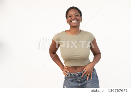 Smiling young woman in casual clothes posing 136767671