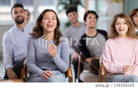 Group of happy students laughing during educational class Group of happy students laughing during educational class 136769165