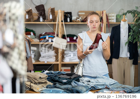 Woman choosing shoes in the store 136769196