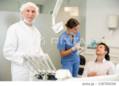Elderly man doctor in dental office Elderly man doctor in dental office 136769206