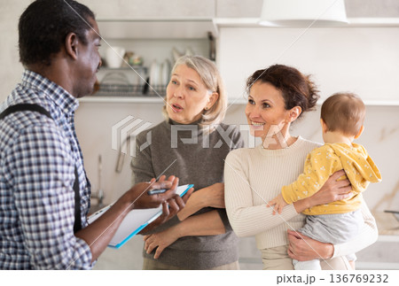Male agent offers good insurance conditions for family of different generation Male agent offers good insurance conditions for family of different generation 136769232