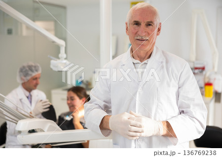 Elderly man doctor in dental office Elderly man doctor in dental office 136769238