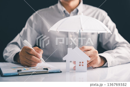 Considering how to insure financial aid, life, house, estate then reviewing charts for security and planning, small umbrella protects house model, and remember to always insure your home model concept 136769382