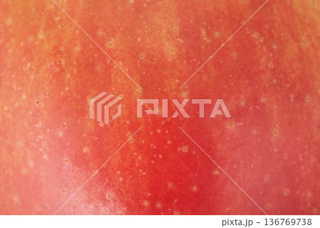 Texture of a red apple as a background macro photo. 136769738