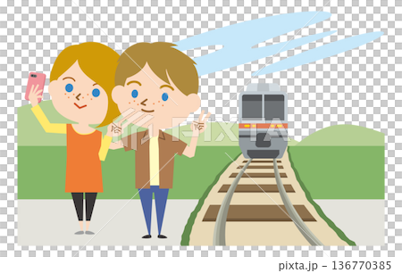 A foreigner taking a selfie in front of a moving train 136770385