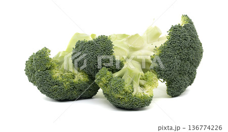 Fresh broccoli florets arranged on a clean white background for healthy eating concepts 136774226