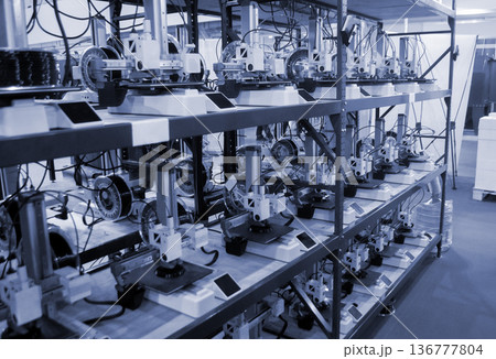 Many 3D printers printing object. 3D printers printing model from molten plastic. 3D printers creating shape from molten plastic flowing out of extruder. New modern 3D Printing additive technologies 136777804