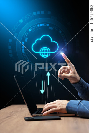 Person using laptop to upload data to cloud storage in digital workspace Person using laptop to upload data to cloud storage in digital workspace 136779862