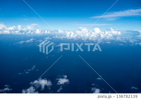 Aerial view of fluffy clouds over the Pacific Ocean in Polynesia Aerial view of fluffy clouds over the Pacific Ocean in Polynesia 136782139
