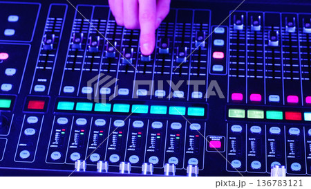 Sound Engineer, Audio Technician Adjusting Faders, Managing Digital Mixing Console From Above, Professional Music Production Concept 136783121