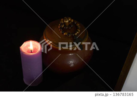 funeral, a photo frame, candles, urn for ashes, holy bible and spiritual bracelet with black cross funeral, a photo frame, candles, urn for ashes, holy bible and spiritual bracelet with black cross 136783165