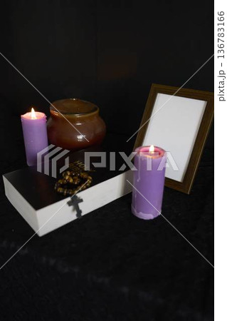 funeral, a photo frame, candles, urn for ashes, holy bible and spiritual bracelet with black cross funeral, a photo frame, candles, urn for ashes, holy bible and spiritual bracelet with black cross 136783166