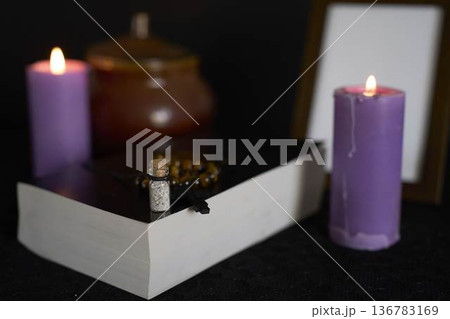 funeral, a photo frame, candles, urn for ashes, holy bible and spiritual bracelet with black cross , pendant with ashes funeral, a photo frame, candles, urn for ashes, holy bible and spiritual bracelet with black cross , pendant with ashes 136783169
