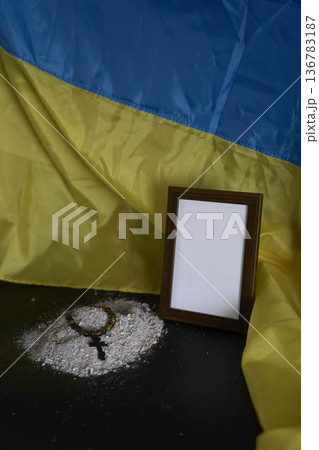 funeral of Ukrainian , a photo frame, ashes, holy bible and spiritual bracelet with black cross funeral of Ukrainian , a photo frame, ashes, holy bible and spiritual bracelet with black cross 136783187