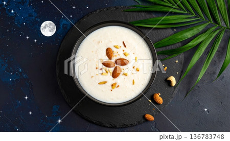A gourmet closeup of fresh chocolate chip cookies with milk and coffee served as a sweet breakfast dish alongside a hot bowl of cream 136783748