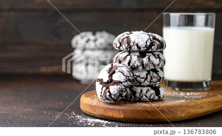 Freshly baked homemade chocolate chip cookies served with a delicious glass of milk make a sweet and tasty dessert snack or breakfast treat from the bakery Freshly baked homemade chocolate chip cookies served with a delicious glass of milk make a sweet and tasty dessert snack or breakfast treat from the bakery 136783806