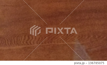 A seamless wood grain texture on a wood surface background, perfect for furniture design and interiors. Detailed rustic timber effect for templates, backgrounds, and creative projects. 136785075