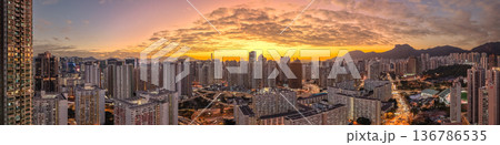 Vibrant sunset colors illuminate Kowloon dense urban skyline Feb 5 2026 136786535