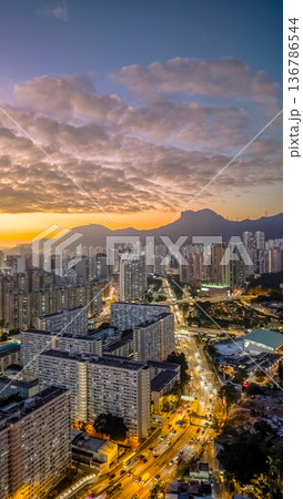 Golden sunset illuminating Choi Hung skyline and mountains Feb 5 2026 136786544
