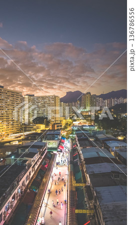 Night market walkway glowing beneath towering city skyline Feb 5 2026 Night market walkway glowing beneath towering city skyline Feb 5 2026 136786556