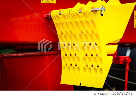 Yellow brake stop blocks wedges on red tractor Yellow brake stop blocks wedges on red tractor 136786778