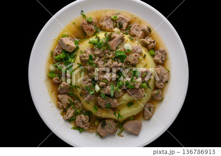 Creamy Mashed Potatoes with Meat on Black 136786913