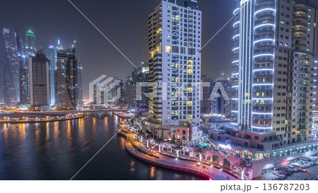 Water canal on Dubai Marina skyline at night timelapse. Water canal on Dubai Marina skyline at night timelapse. 136787203