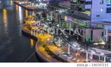 Water canal on Dubai Marina skyline at night timelapse. 136787215