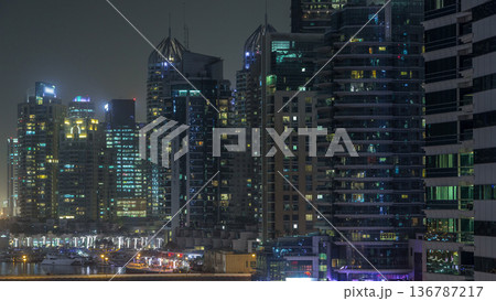 Water canal on Dubai Marina skyline at night timelapse. 136787217
