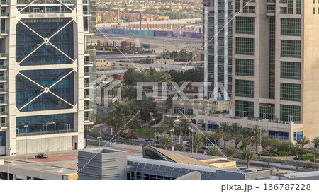 Aerial view of Jumeirah lakes towers skyscrapers timelapse with traffic on sheikh zayed road. Aerial view of Jumeirah lakes towers skyscrapers timelapse with traffic on sheikh zayed road. 136787228