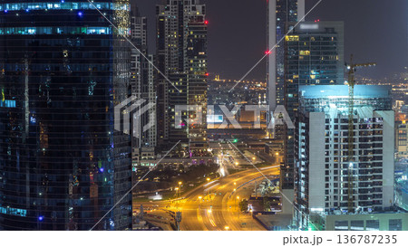 Dubai business bay towers night timelapse aerial 136787235
