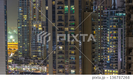 Water canal on Dubai Marina skyline at night timelapse. 136787268