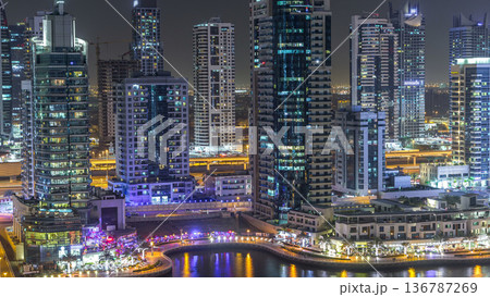 Water canal on Dubai Marina skyline at night timelapse. 136787269