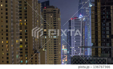 Night illumination of Dubai Marina aerial timelapse, UAE. 136787366